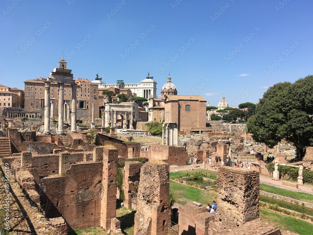 Rome, Italy - 4 September 2016: Il Tempio dei Dioscuri and the House of the Vestals in the Roman Forum in Rome, Italy, looking towards the Templo de Saturno from the Via dei Verchi.