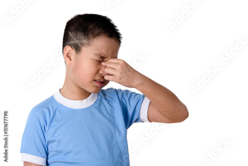 Young asian boy has pain his nose