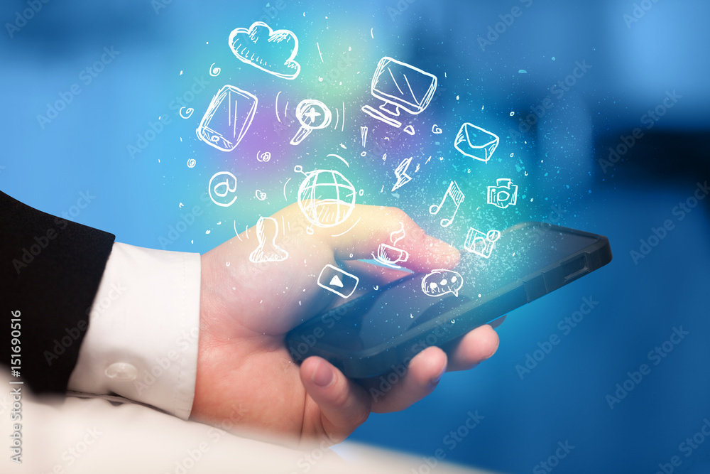 Hand holding smartphone with media icons Hand holding smartphone with media icons