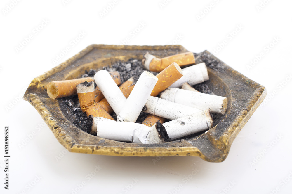 Cigarette butts in ashtray. Cigarette butts in ashtray.