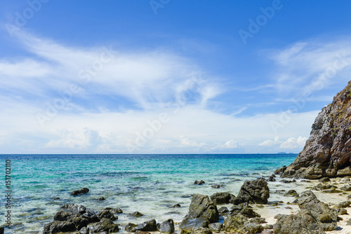 Rocky beach and blue sea at koh khai island in satun thailand