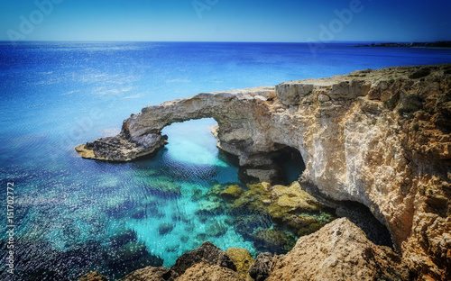 Beautiful natural rock arch near of Ayia Napa, Cavo Greco and Protaras on Cyprus island, Mediterranean Sea. Legendary bridge lovers.