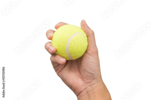 Hand holding tennis ball isolated on white background.