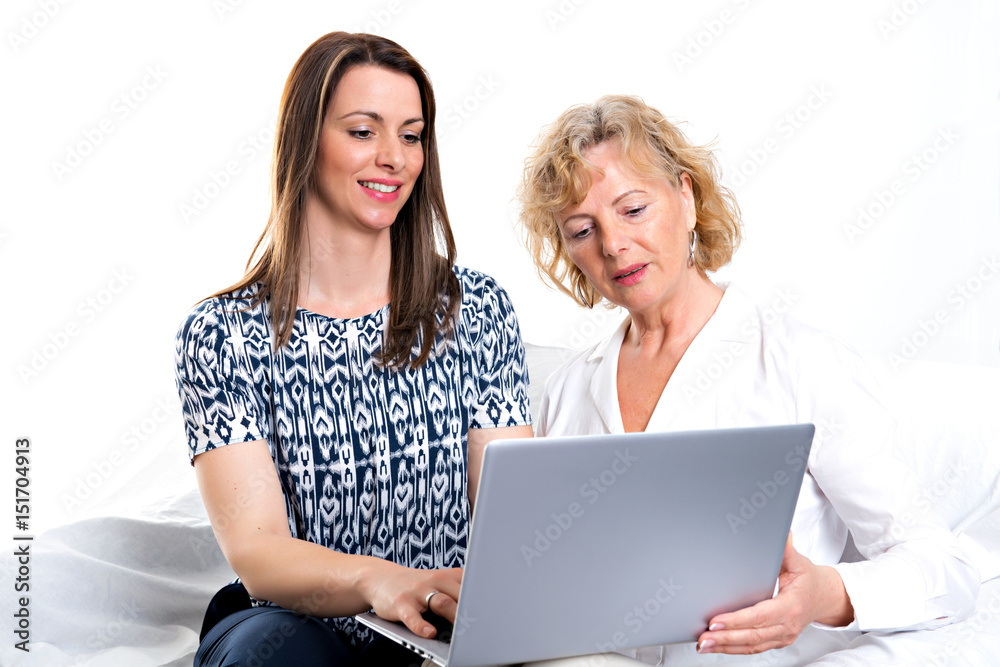 young woman and her mother with laptop young woman and her mother with laptop