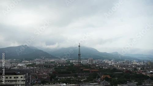 Clouds on top of hill,City buildings relying on mountain.Panoramic of Taishan,Tai'an-City. photo