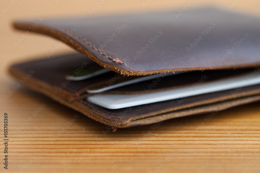 leather wallet on the wooden table leather wallet on the wooden table