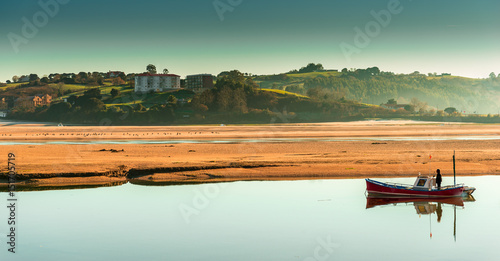 Fisherman and low tide in San Vicente de la Barquera