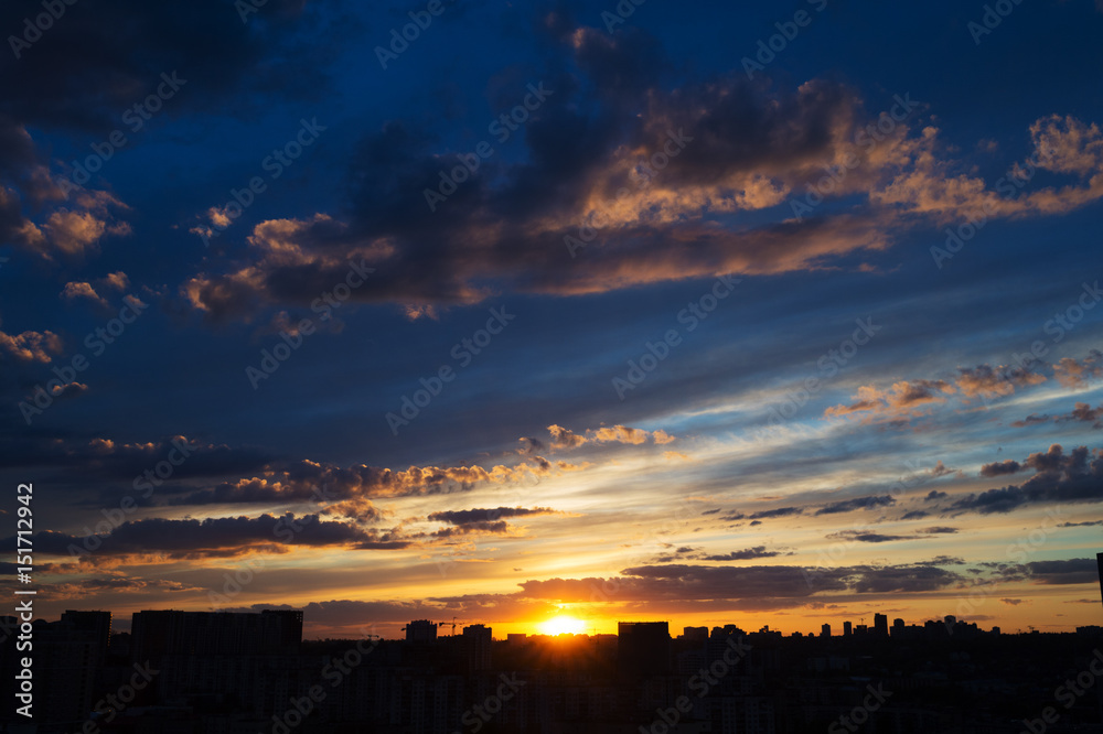 Beautiful sunrise over big city with amazing clouds