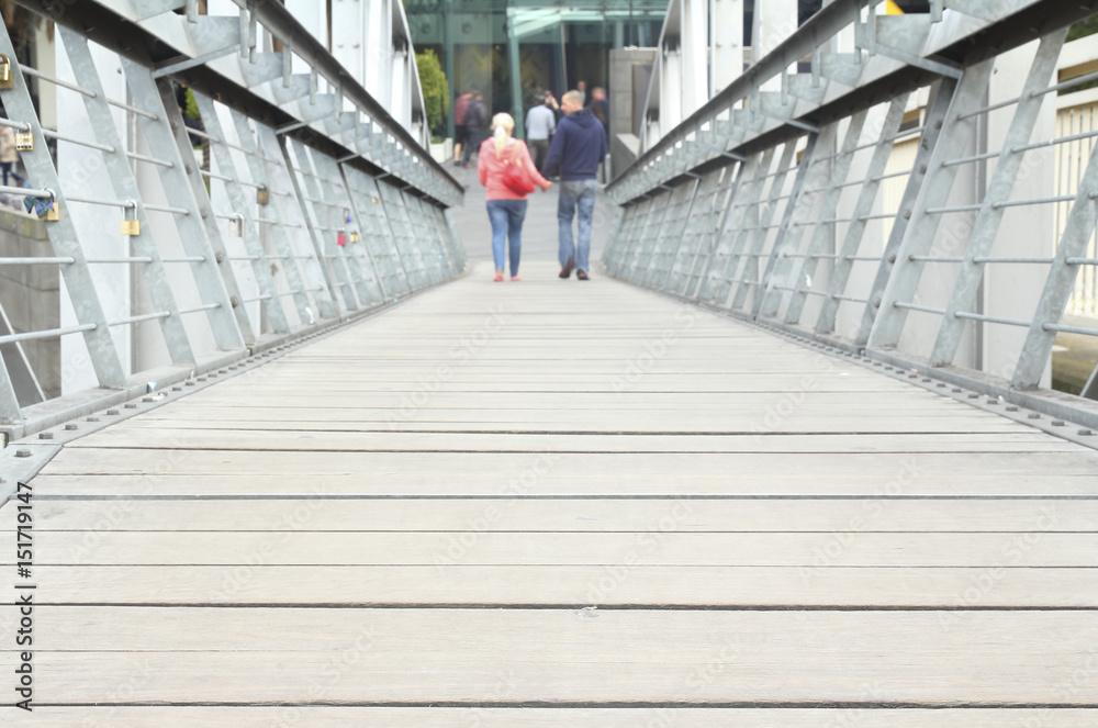 Couple walking on the bridge, walk on the old wooden bridge.