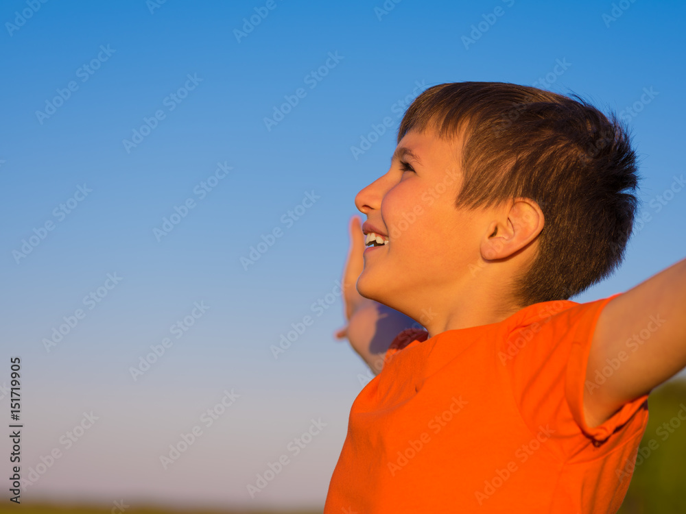 Happy person in the nature with raised arms Happy person in the nature with raised arms