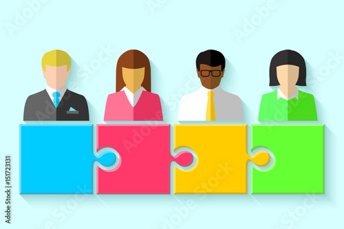 Multiracial group of business people and puzzle concept. Teamwork, cooperation and partnership symbol.