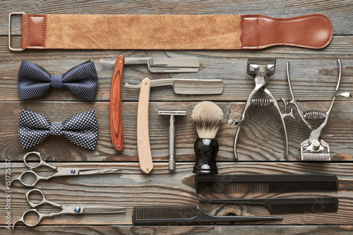 Vintage barber shop tools on wooden background