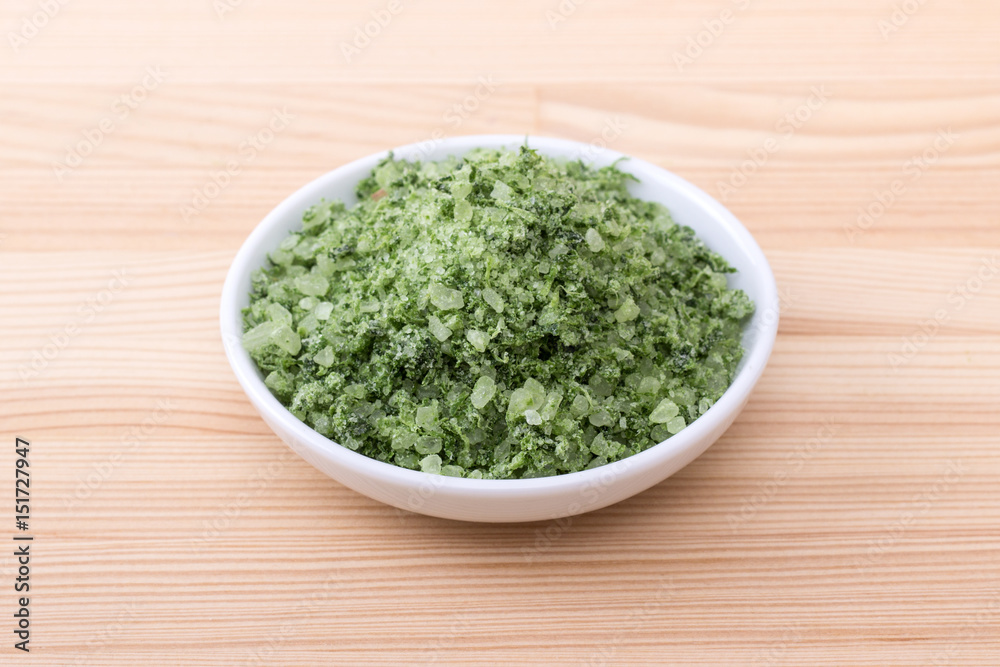 herbal salt from wild garlic / Porcelain bowl with green herbal salt of wild garlic herbal salt from wild garlic / Porcelain bowl with green herbal salt of wild garlic