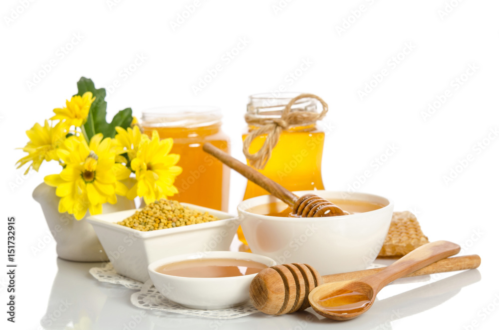 Yellow flowers and bee products (honey, pollen) isolated on white background Yellow flowers and bee products (honey, pollen) isolated on white background