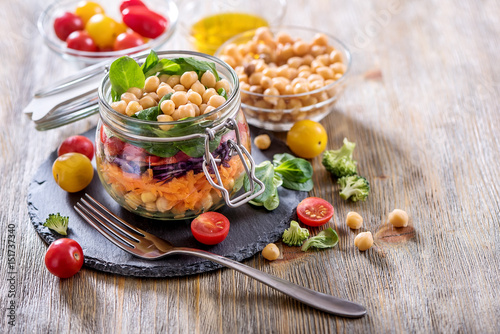 Healthy mason jar salad with chickpea and veggies, diet, vegetarian, vegan food