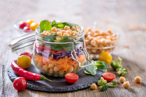 Healthy mason jar salad with chickpea and veggies, diet, vegetarian, vegan food