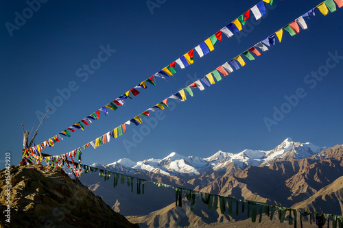 Buddhist prayer flags above the Indian Himalayas in Leh, Ladakh, India