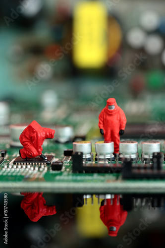 Miniature scale model chemical team on a circuit board