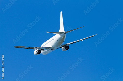  flying airplane on a clear sunny day