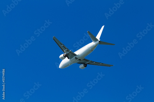  flying airplane on a clear sunny day