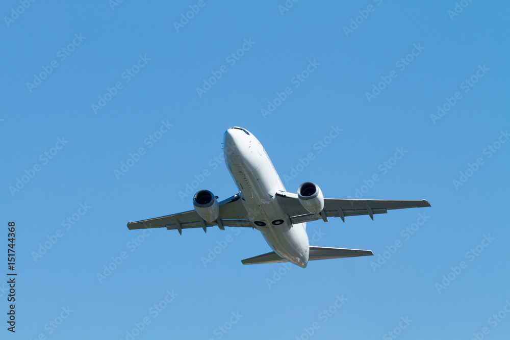  flying airplane on a clear sunny day