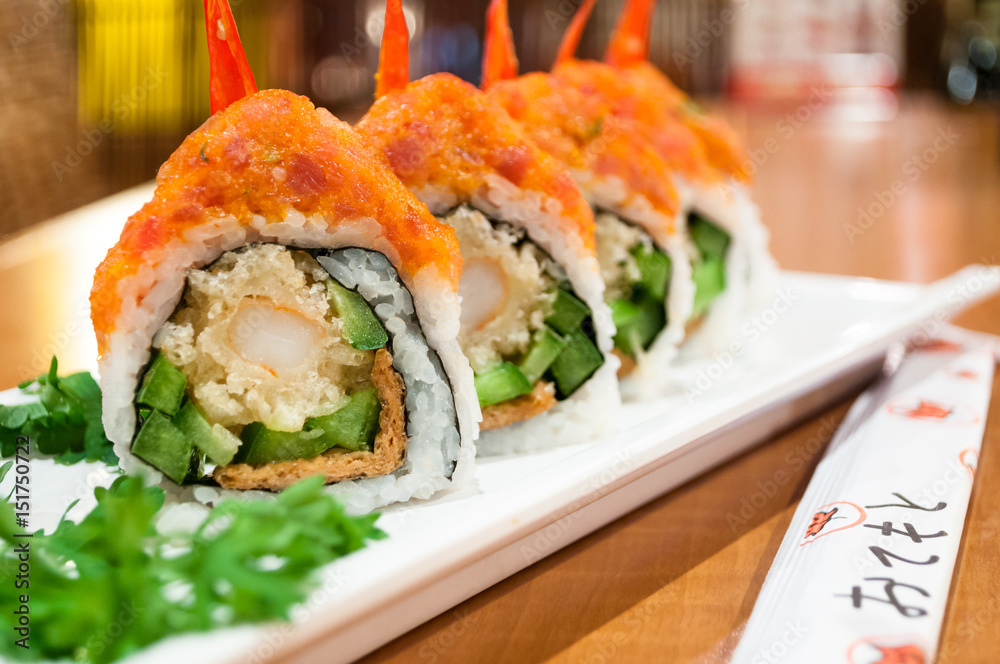 A delicious shrimp tempura roll topped with tuna tartare. A delicious shrimp tempura roll topped with tuna tartare.