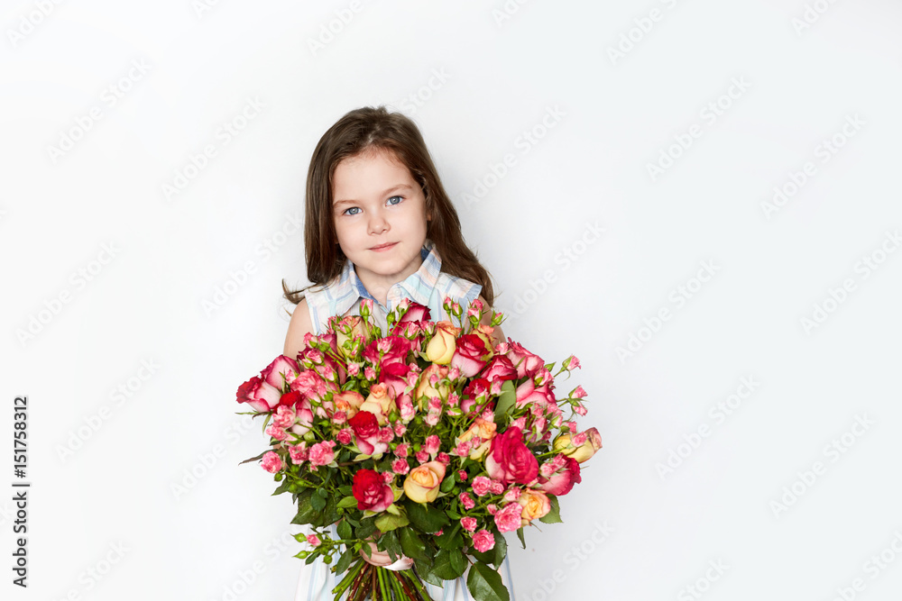smiling little girl with a roses 