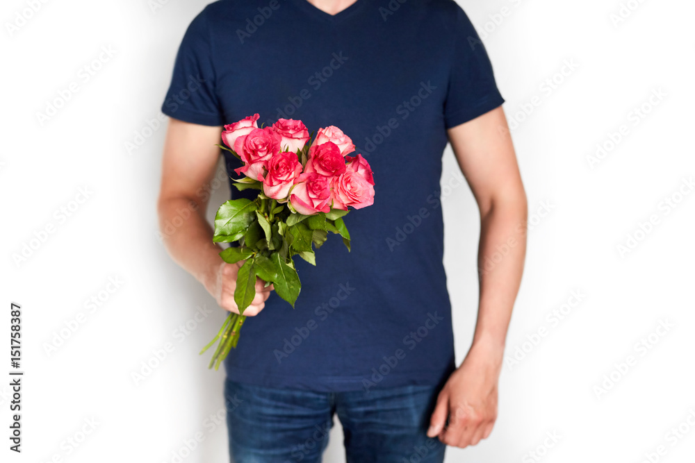a man with red roses in the hands. valentine day love beautiful a man with red roses in the hands. valentine day love beautiful