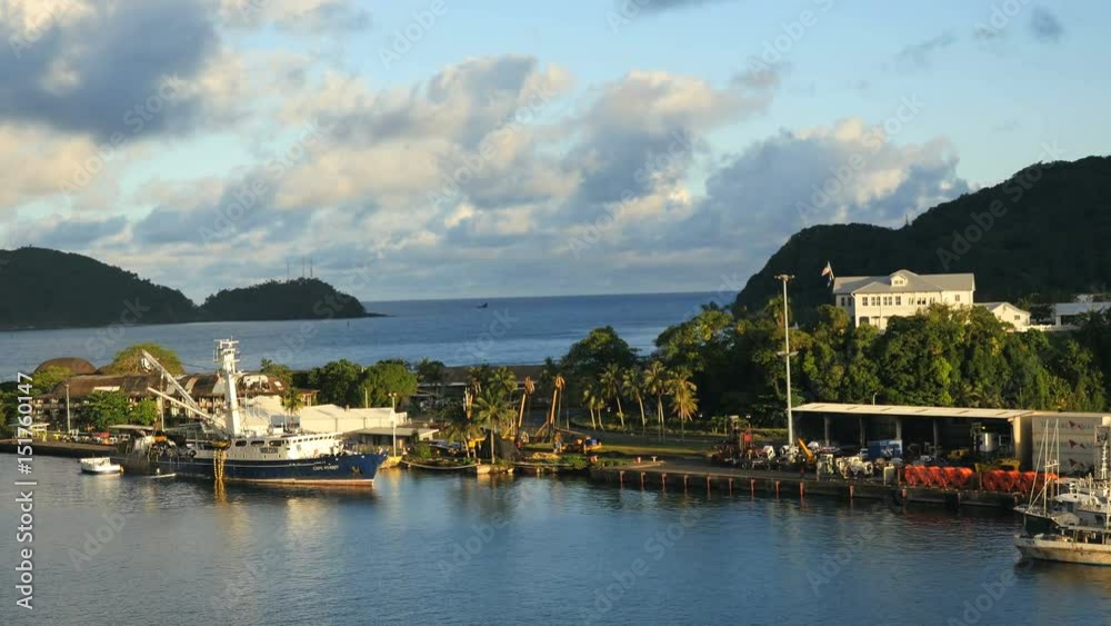 tracking very wide shot of dock with boats in american samoa tracking very wide shot of dock with boats in american samoa