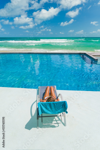Relaxing woman in luxury hotel pool on holidays vacation © Netfalls