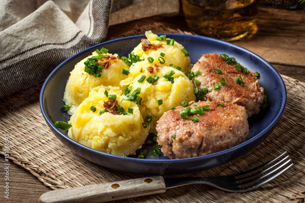 Meatballs served with boiled potatoes on a plate. Meatballs served with boiled potatoes on a plate.