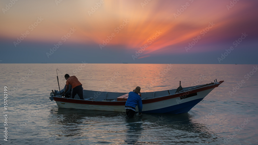 Fishing men on sunrise