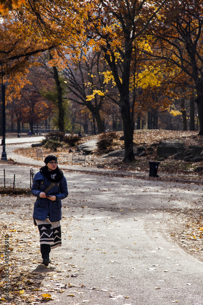 Woman on Central Park Path in Autumn