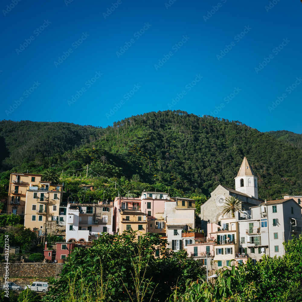 Scenic view of Corniglia, small coastal village, Cinque Terre national park, La Spezia Region, Liguria, Italy. Beautiful travel destination square postcard.