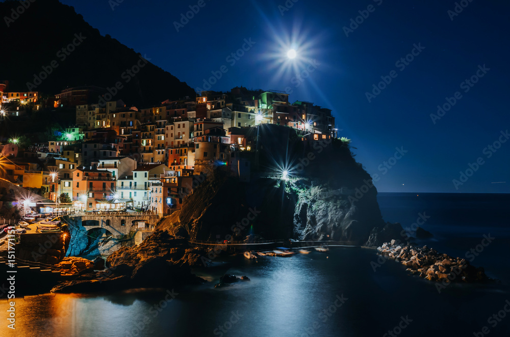 Manarola scenic cityscape in the moonlight.