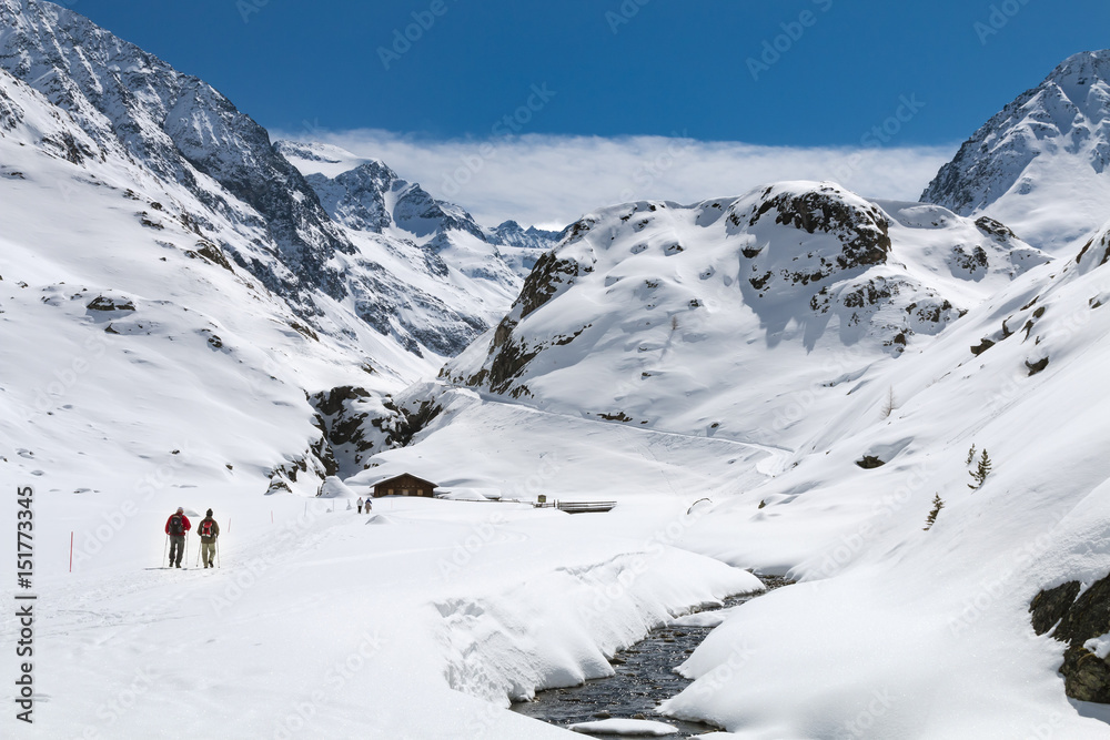 Hikers In Winter Valley, Austria Hikers In Winter Valley, Austria