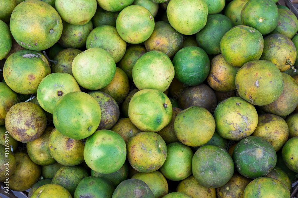 Fresh mandarin oranges on an organic food market of tropical Bali island, Indonesia. Mandarin background. Fresh mandarin oranges on an organic food market of tropical Bali island, Indonesia. Mandarin background.