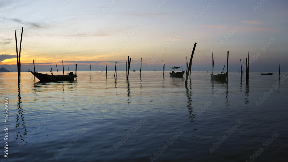 View in Time of sunrise on a beach of a fishing village