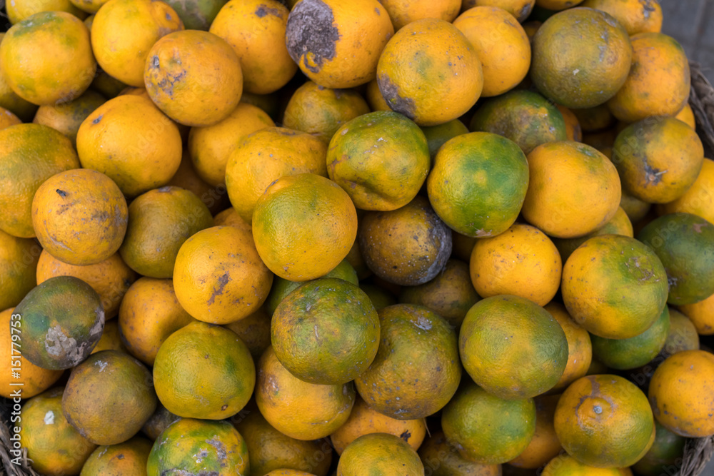 Fresh mandarin oranges on an organic food market of tropical Bali island, Indonesia. Mandarin background. Fresh mandarin oranges on an organic food market of tropical Bali island, Indonesia. Mandarin background.