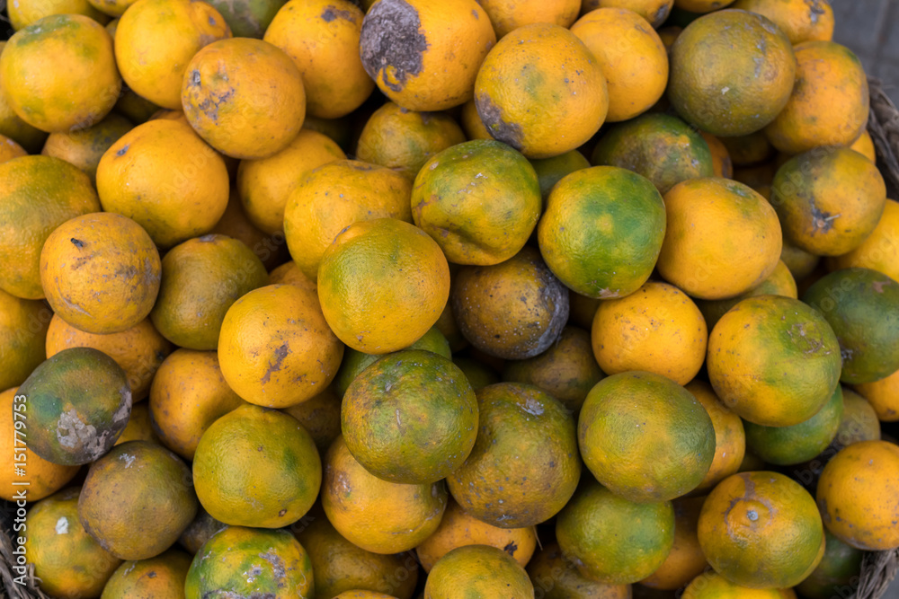 Fresh mandarin oranges on an organic food market of tropical Bali island, Indonesia. Mandarin background.