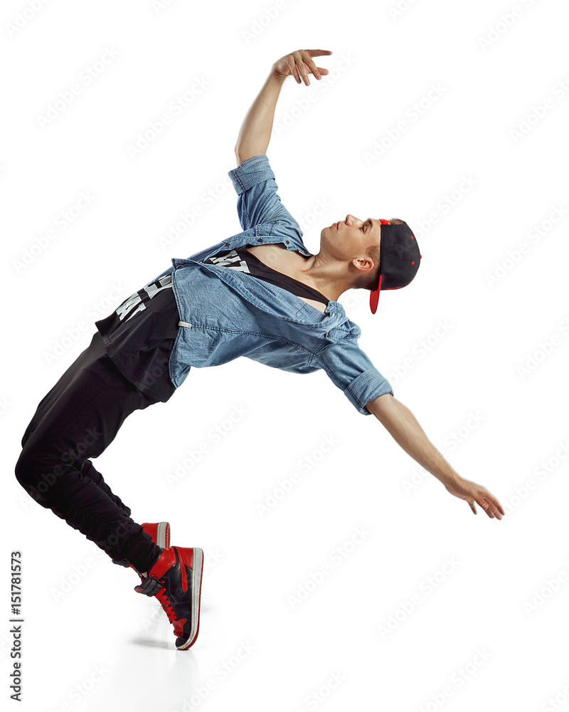 Fototapeta Full length portrait of an excited man dancing isolated on white background
