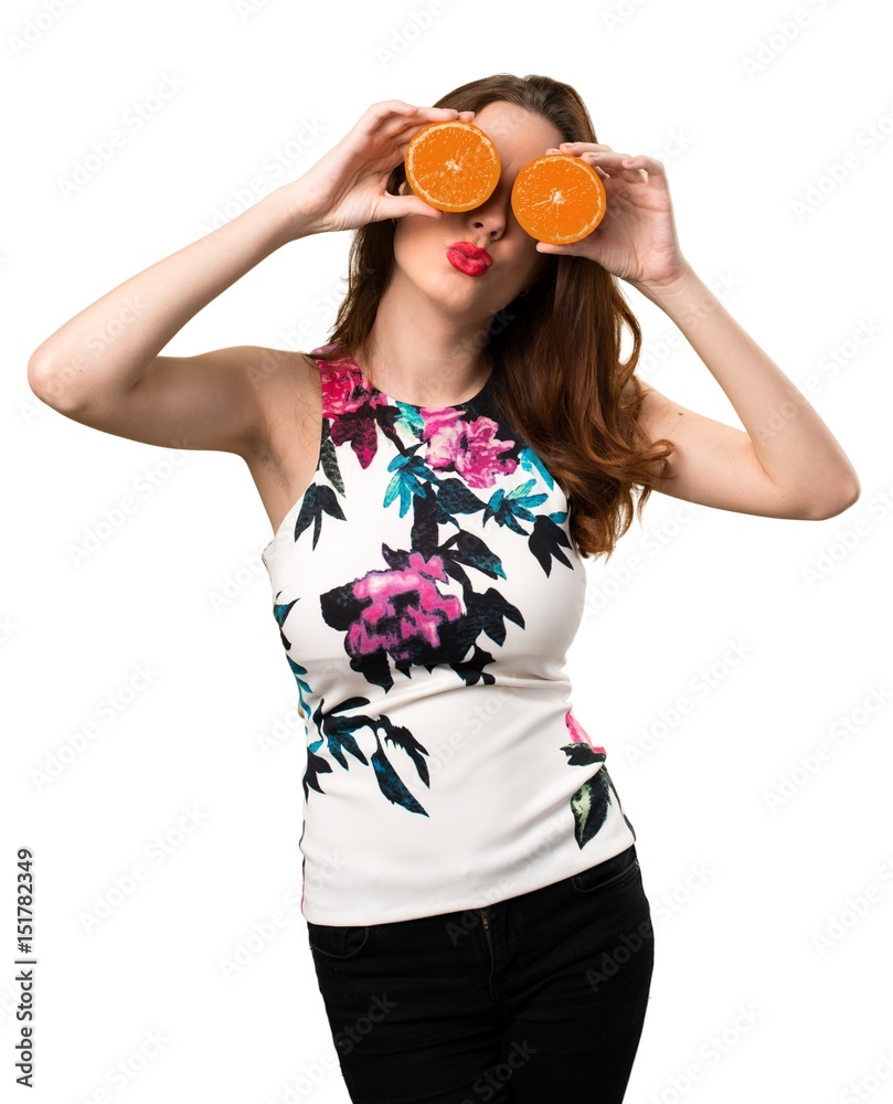 Beautiful young girl wearing orange slices as glasses Beautiful young girl wearing orange slices as glasses