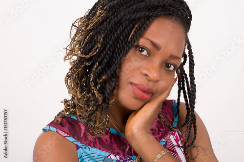Portrait of pretty African woman with hand under her chin.