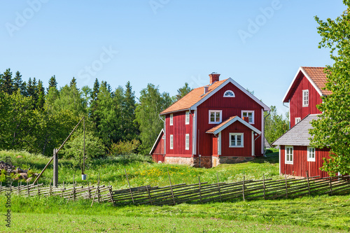 Red farm house in rural environment
