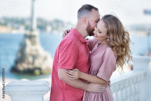Young fashion couple of lovers at beginning of love story - Handsome man whispers sexy kisses in pretty woman ear - Relationship love concept with boyfriend and girlfriend together - Warm retro filter