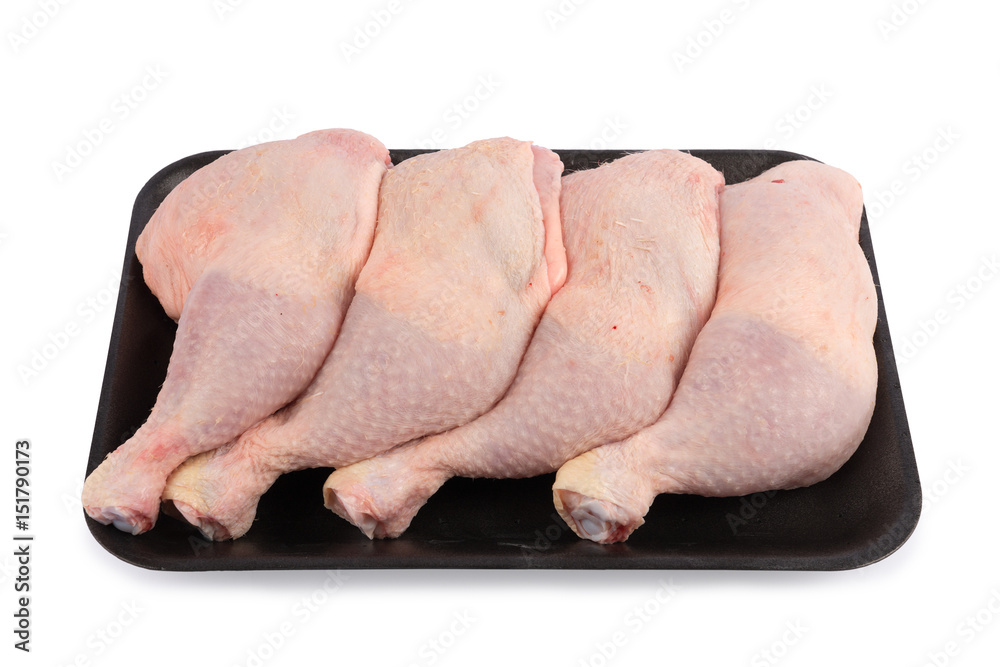 Raw chicken thighs isolated on white background. Raw chicken thighs isolated on white background.