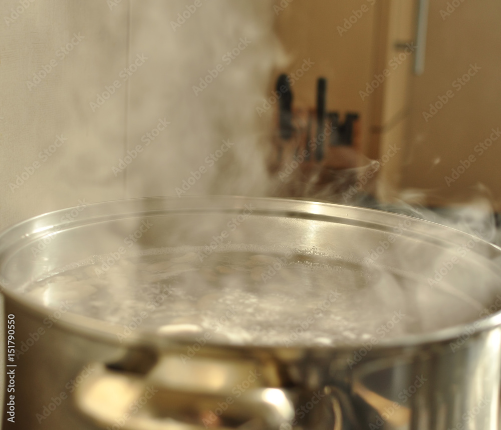 Steam over metal cooking pot