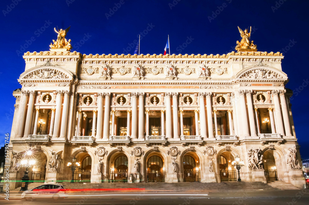 The magnificent Palais Garnier at dusk in Paris, France.