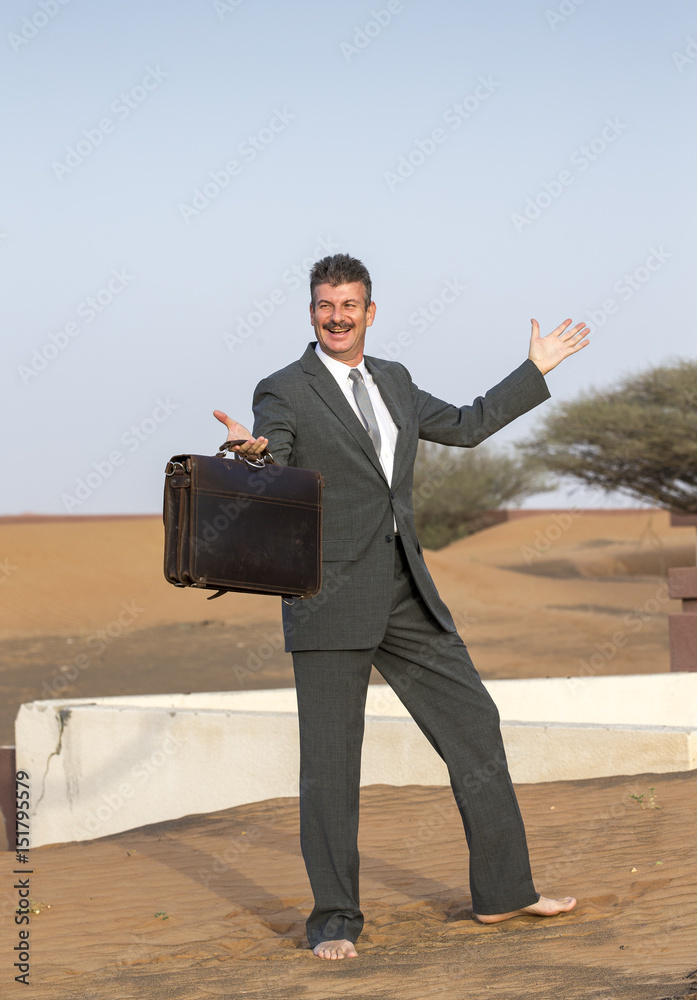 businessman with a briefcase in a desert village businessman with a briefcase in a desert village