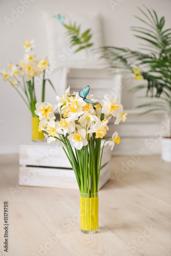 daffodils with butterflies, spring background of flowers.